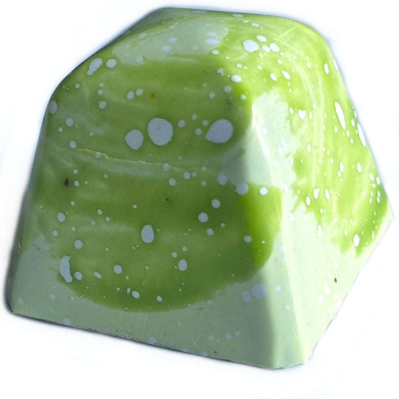 A mid-day craving for a Mangonada was the inspiration for this wildly fruity concoction! Lychee jam is layered over a tart mango ganache that's been finished with a touch of Del Maguey Vida mezcal.